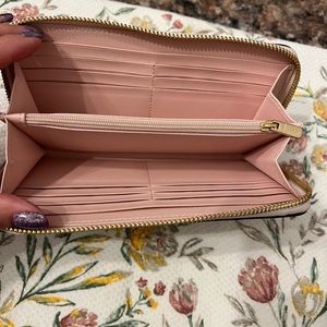 Beautiful soft floral coach wallet .